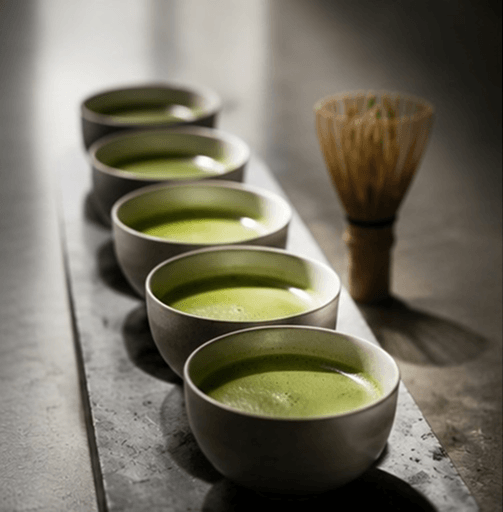 Bowls of freshly whisked ceremonial matcha